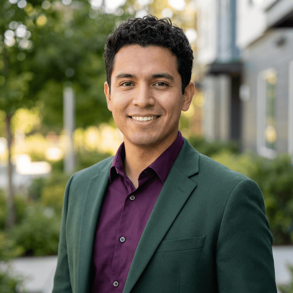 Luken Diaz, owner of Clean House Elite Services, standing in a bright living room